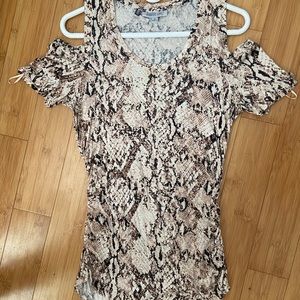 Jennifer Lopez rushed shoulder slit stretch shirt